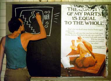 Keith Haring at work on a subway drawing